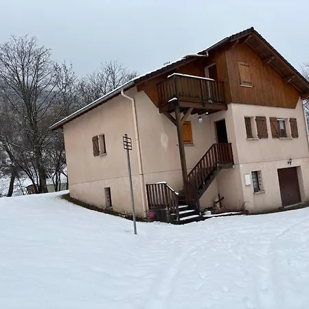 House Surrounded By Creek Chalet